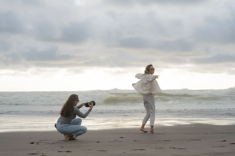 Holly Rogers photographing on the beach